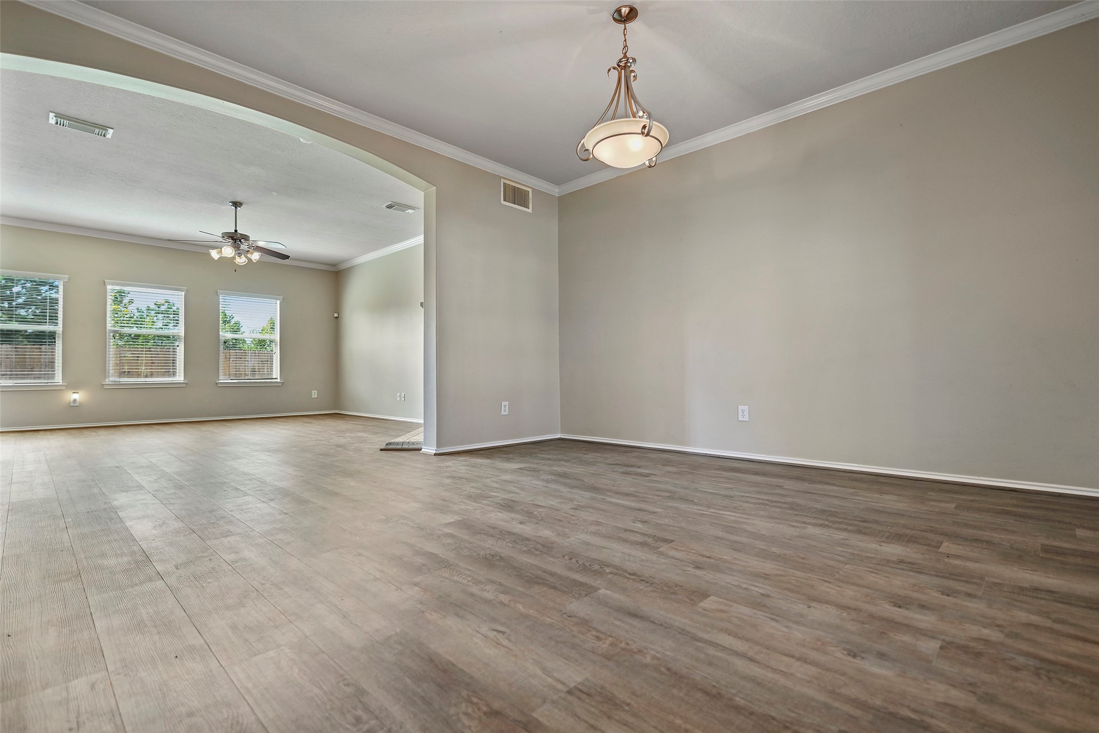 20739 Stewart Crest Lane Cypress, TX 77433 - Photo 5 of 35 an empty room with wooden floor and windows