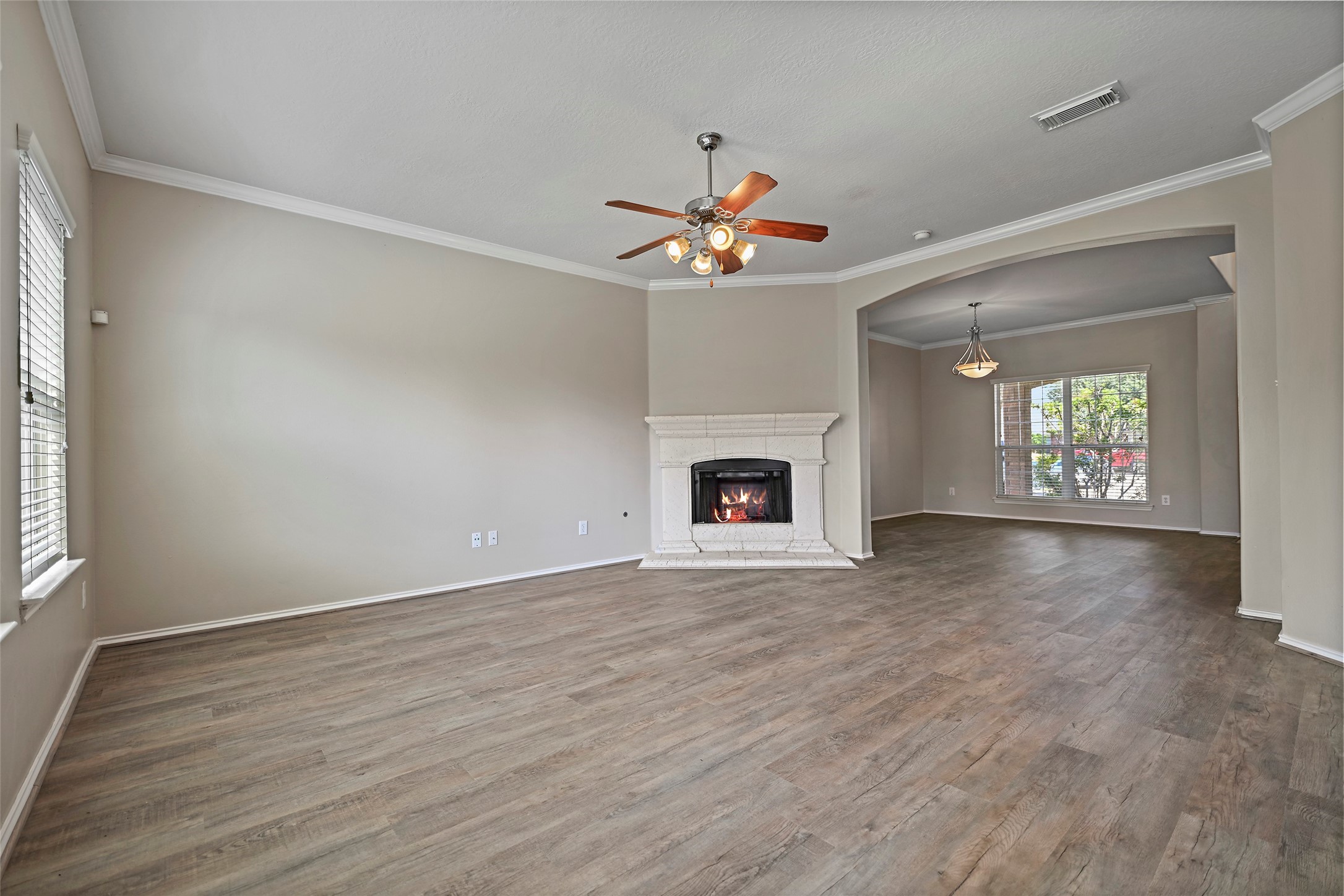 20739 Stewart Crest Lane Cypress, TX 77433 - Photo 6 of 35 an empty room with windows and fireplace