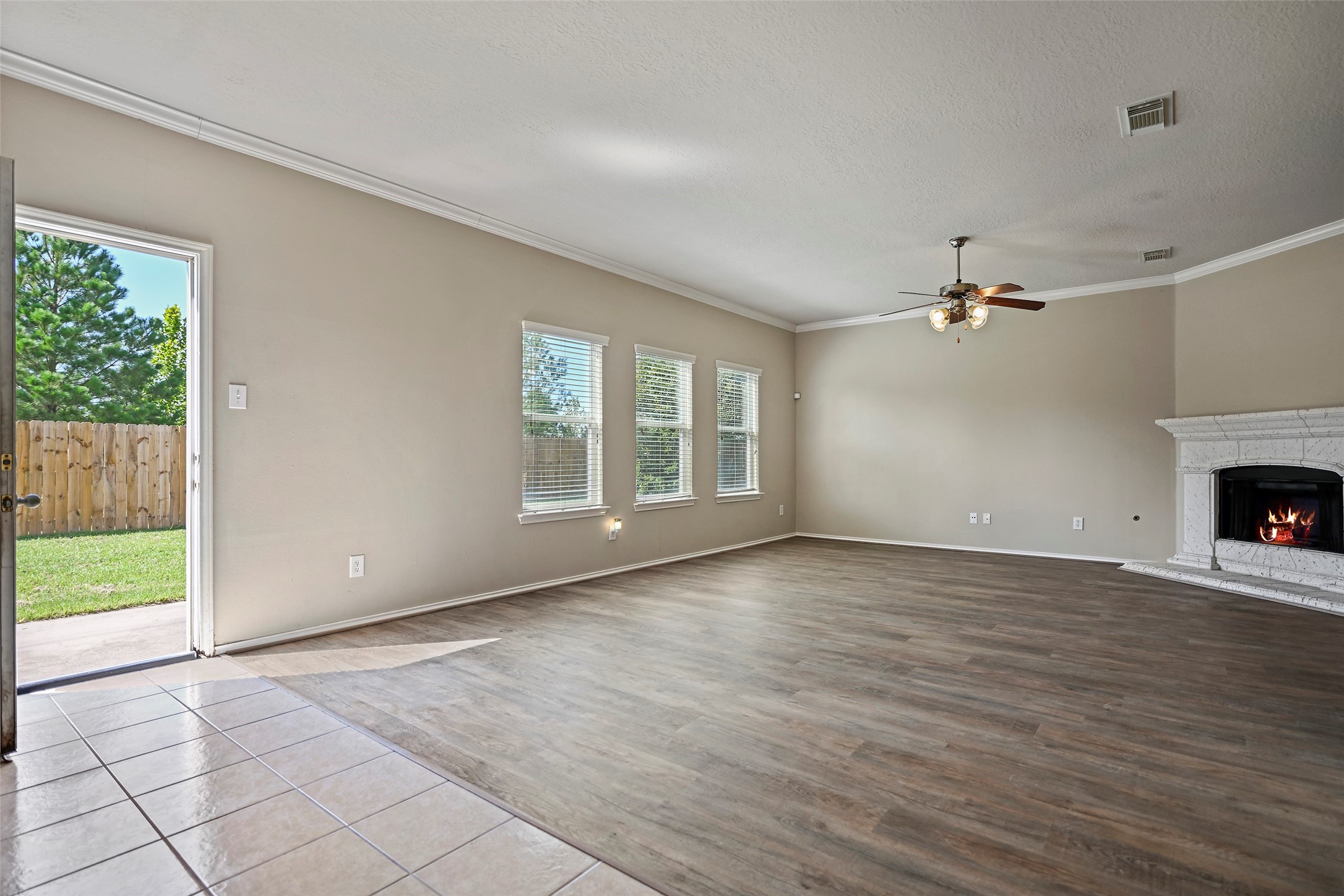 20739 Stewart Crest Lane Cypress, TX 77433 - Photo 8 of 35 a view of an empty room with wooden floor and a window