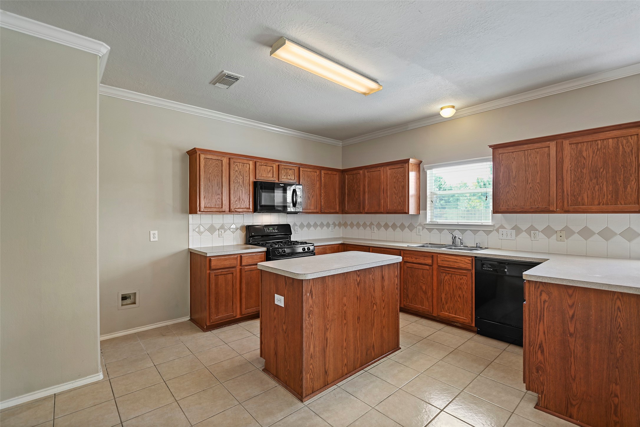 20739 Stewart Crest Lane Cypress, TX 77433 - Photo 9 of 35 a kitchen with stainless steel appliances granite countertop a stove top oven sink and cabinets