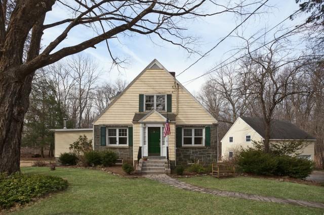 25 Staples Road Easton, CT 06612 - Photo 1 of 1 a front view of a house with a yard and garage