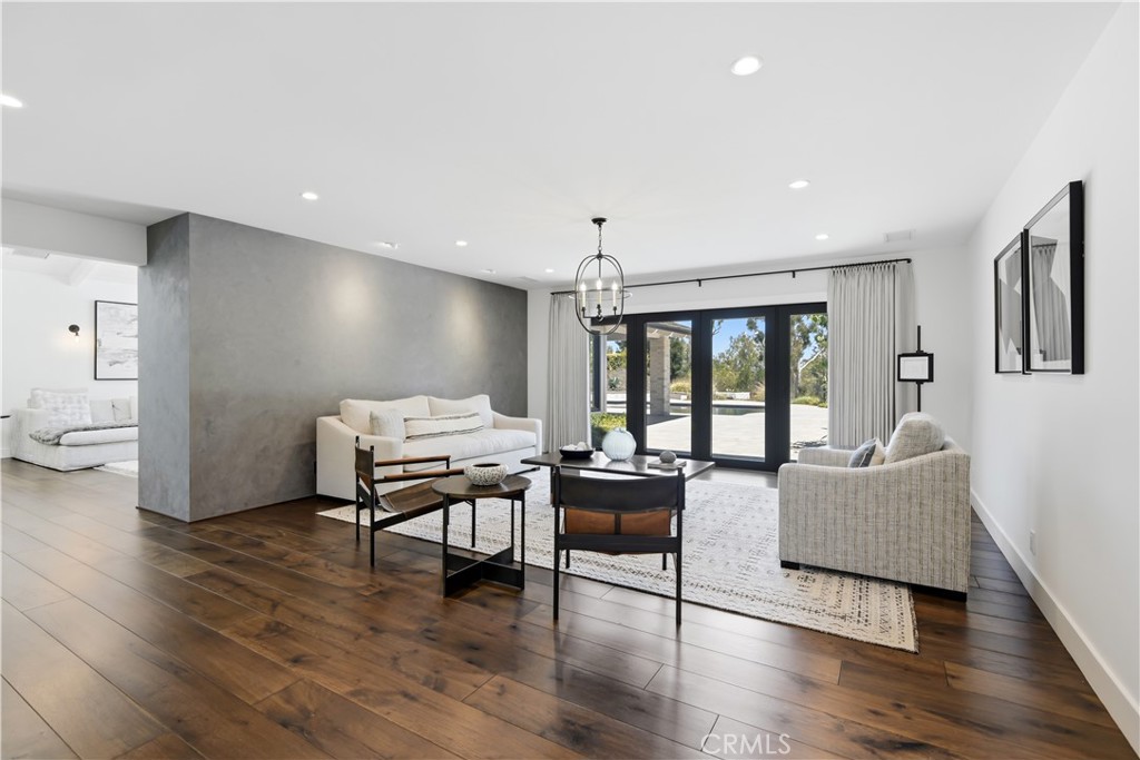 24884 Jim Bridger Road Hidden Hills, CA 91302 - Photo 5 of 31 a living room with furniture and a large window