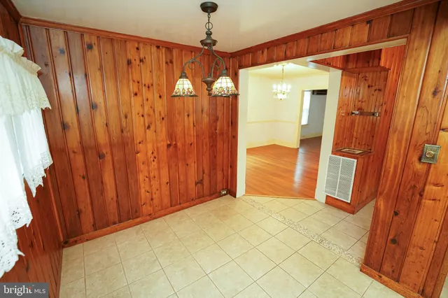 a view of a bathroom with shower and a tub