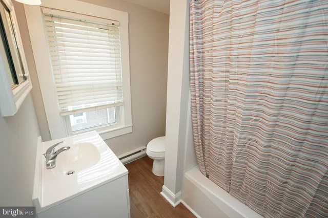 a bathroom with a sink and a window