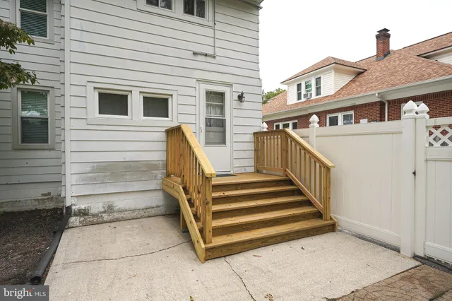 a front view of a house with an outdoor seating