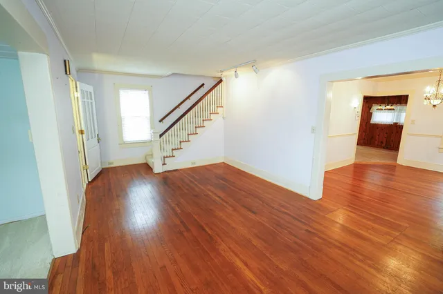 a view of an entryway with wooden floor