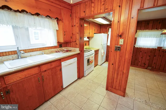 a bathroom with a sink a mirror and a shower