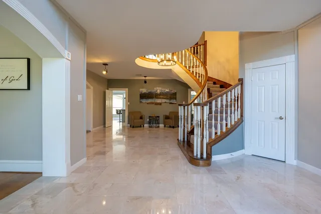 an entryway and a livingroom with furniture