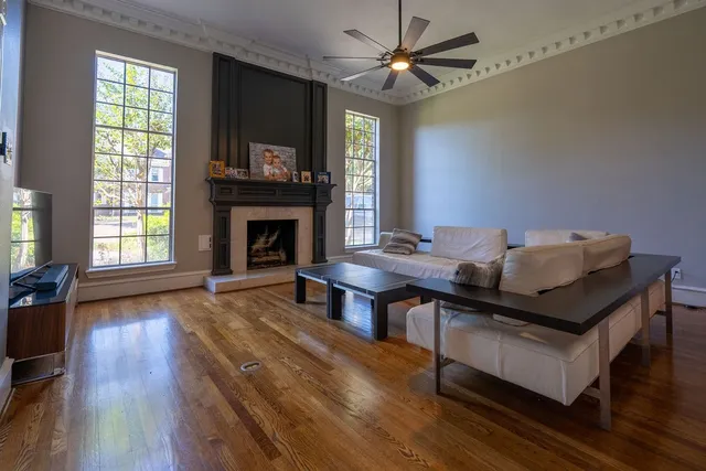 a living room with furniture and a fireplace