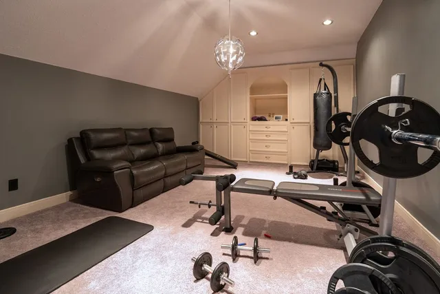 a livingroom with furniture and a mirror