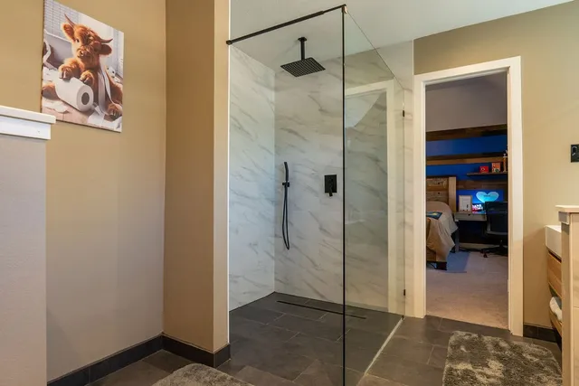 a bathroom with a shower and a sink