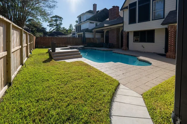 a view of a backyard with sitting area