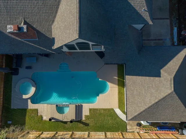 a view of a house with a small yard and plants