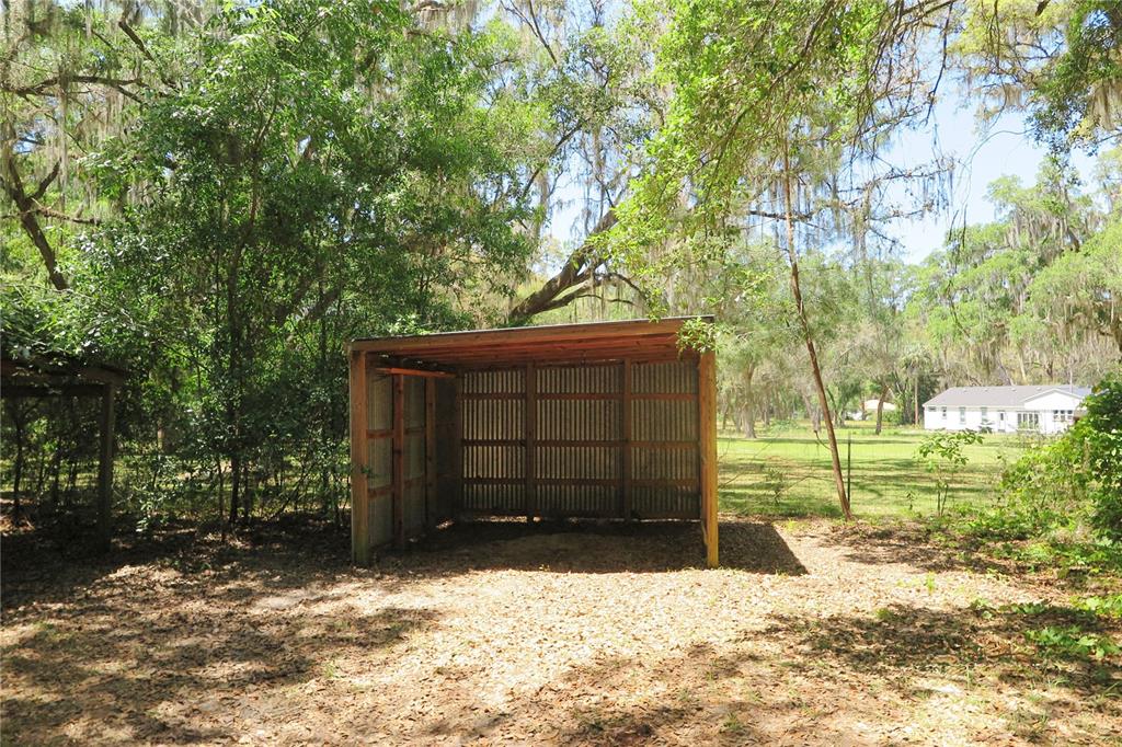 153-UNIT Ranch Road San Mateo, FL 32187 - Photo 30 of 34 a view of a backyard of the house
