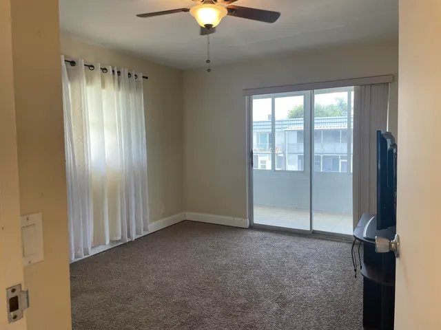 a view of an empty room with a window