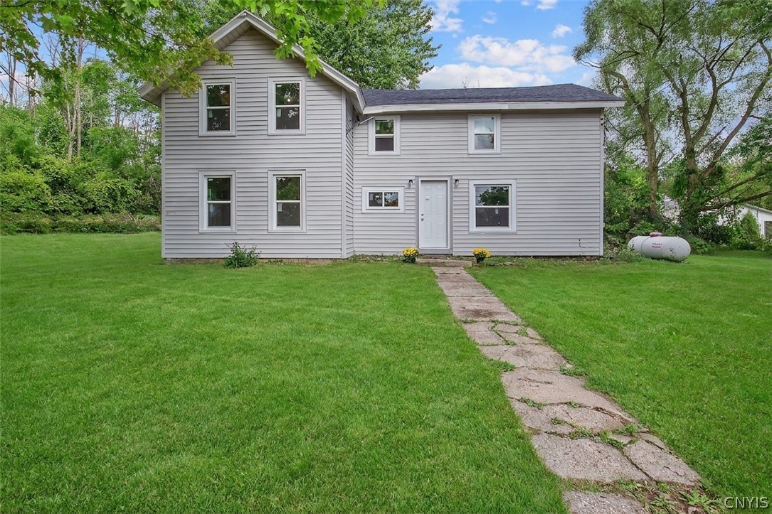 Grass virtually enhanced. Updated siding, windows,