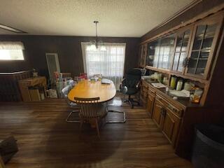 4515 South Bonham Street Amarillo, TX 79110 - Photo 21 of 21 a room with wooden floor table and chairs