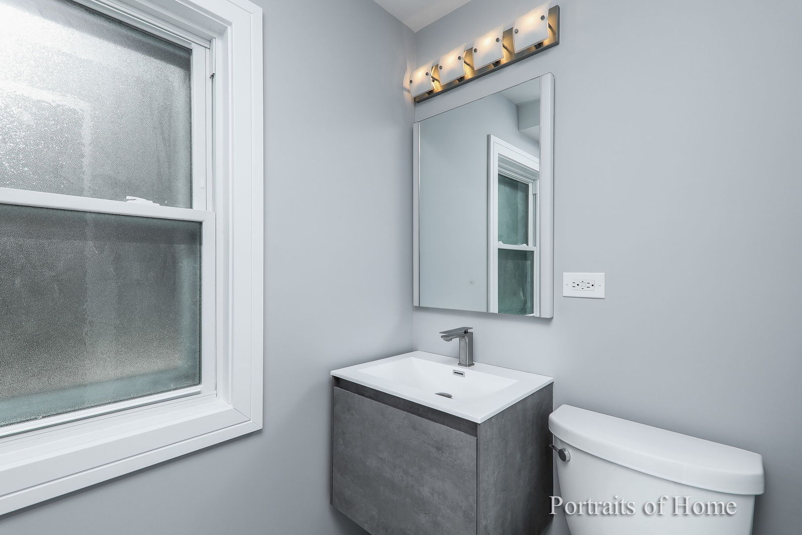 1181 Sherwood Road Highland Park, IL 60035 - Photo 11 of 22 a bathroom with a sink a toilet and mirror