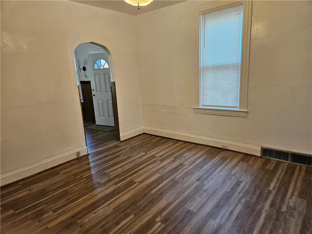 2212 Cronemeyer Street McKeesport, PA 15132 - Photo 15 of 48 an empty room with wooden floor and a window