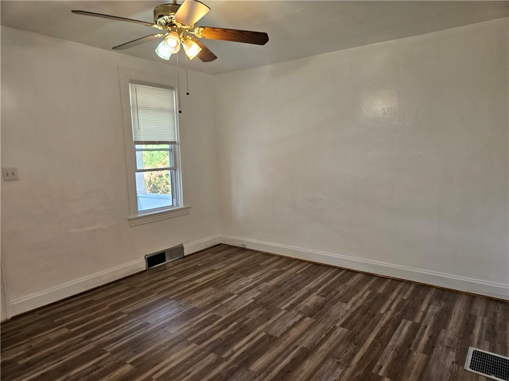 2212 Cronemeyer Street McKeesport, PA 15132 - Photo 17 of 48 wooden floor in an empty room with a window