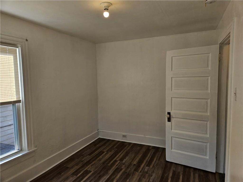 2212 Cronemeyer Street McKeesport, PA 15132 - Photo 34 of 48 a view of an empty room with wooden floor and a window