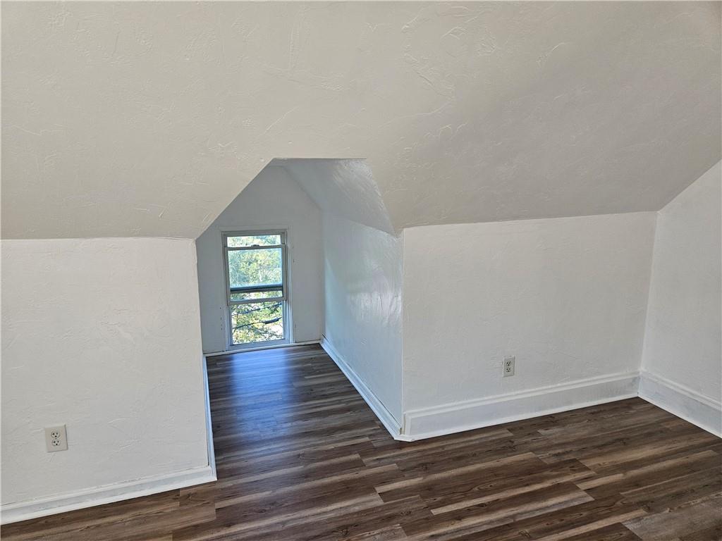 2212 Cronemeyer Street McKeesport, PA 15132 - Photo 47 of 48 a view of an empty room with wooden floor and a window