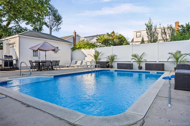 a view of a swimming pool with a lounge chairs