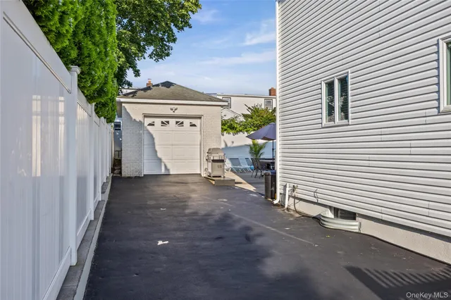 a view of a house with a yard and garage
