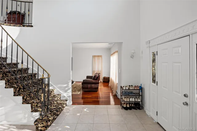 a view of kitchen with furniture and entryway