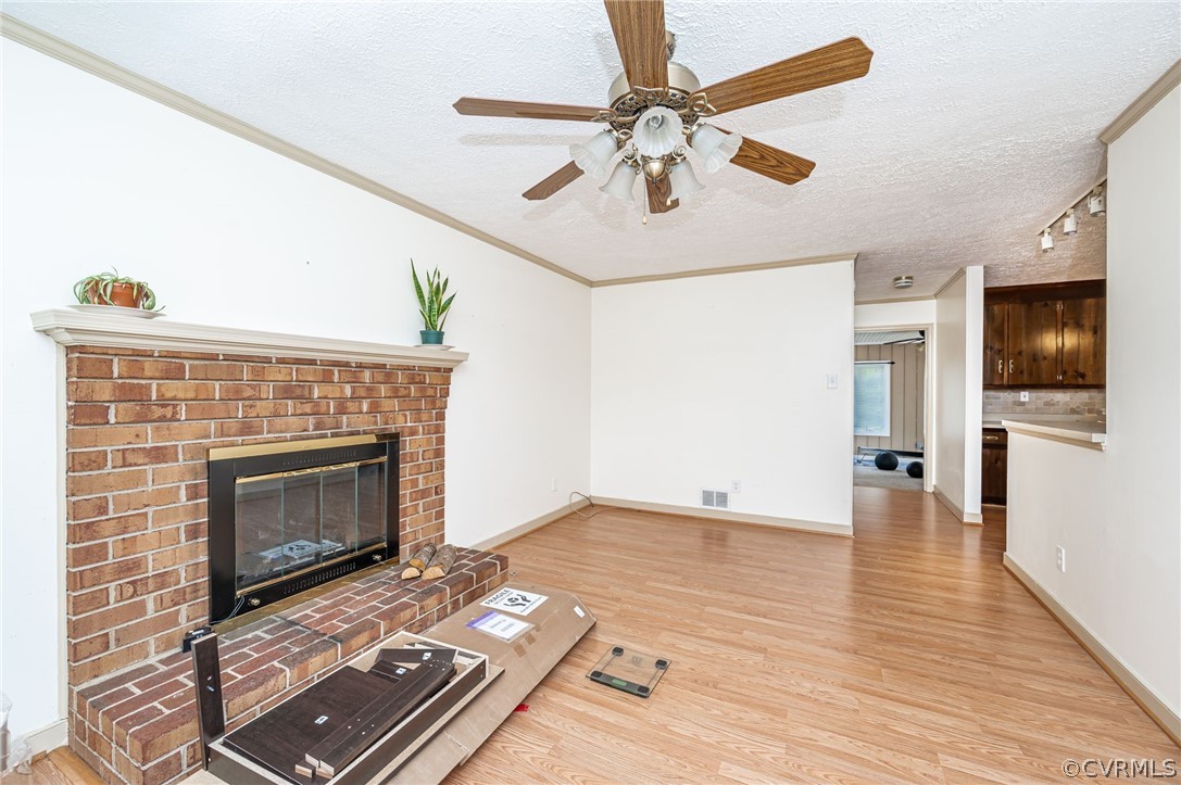 11420 Elshur Road Midlothian, VA 23112 - Photo 11 of 25 a living room with furniture and a fireplace
