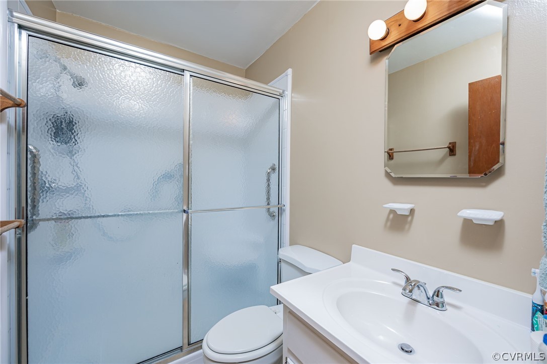 11420 Elshur Road Midlothian, VA 23112 - Photo 16 of 25 a bathroom with a sink and a mirror
