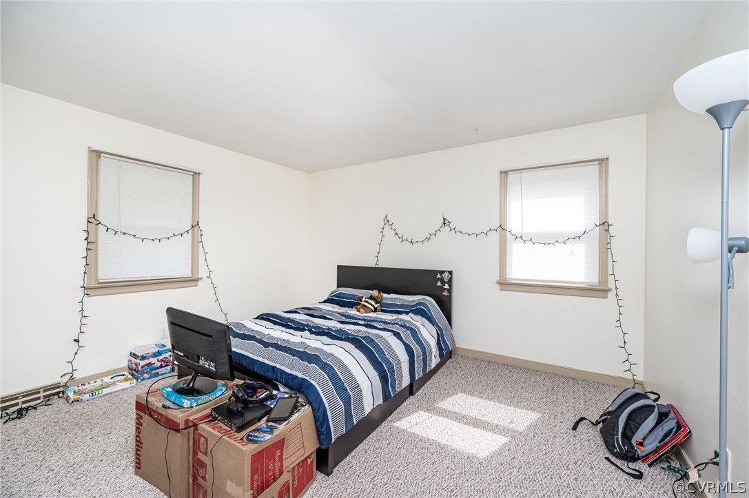 11420 Elshur Road Midlothian, VA 23112 - Photo 17 of 25 a bedroom with a bed and a window
