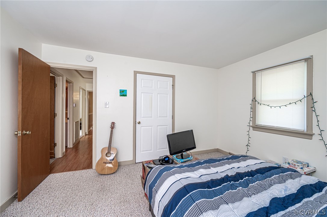 11420 Elshur Road Midlothian, VA 23112 - Photo 18 of 25 a bedroom with a bed and a window