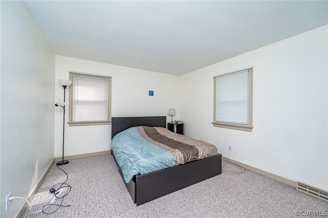 11420 Elshur Road Midlothian, VA 23112 - Photo 19 of 25 a bedroom with a bed and a window