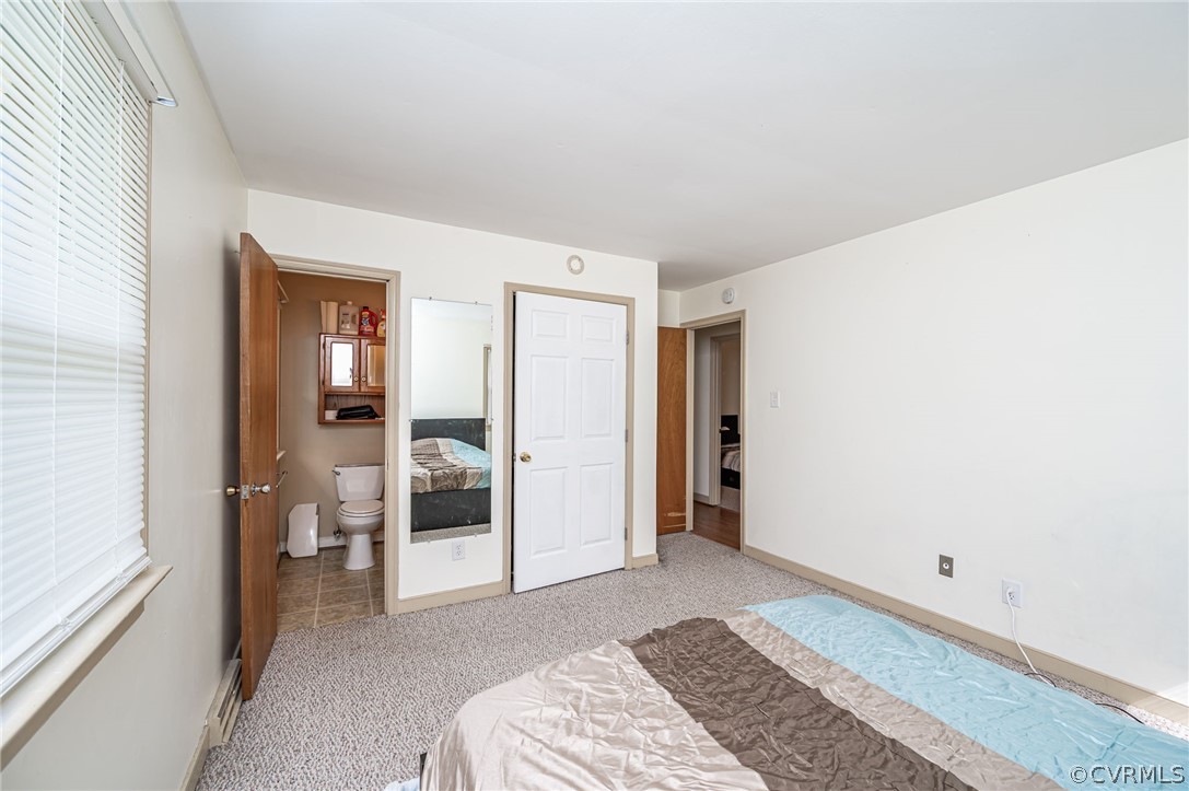 11420 Elshur Road Midlothian, VA 23112 - Photo 20 of 25 a bedroom with a bed and a bathroom
