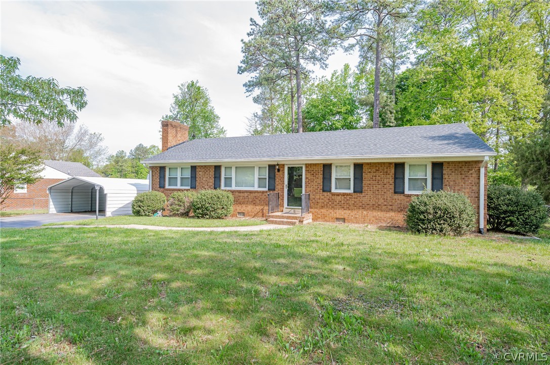 11420 Elshur Road Midlothian, VA 23112 - Photo 3 of 25 a front view of a house with a garden