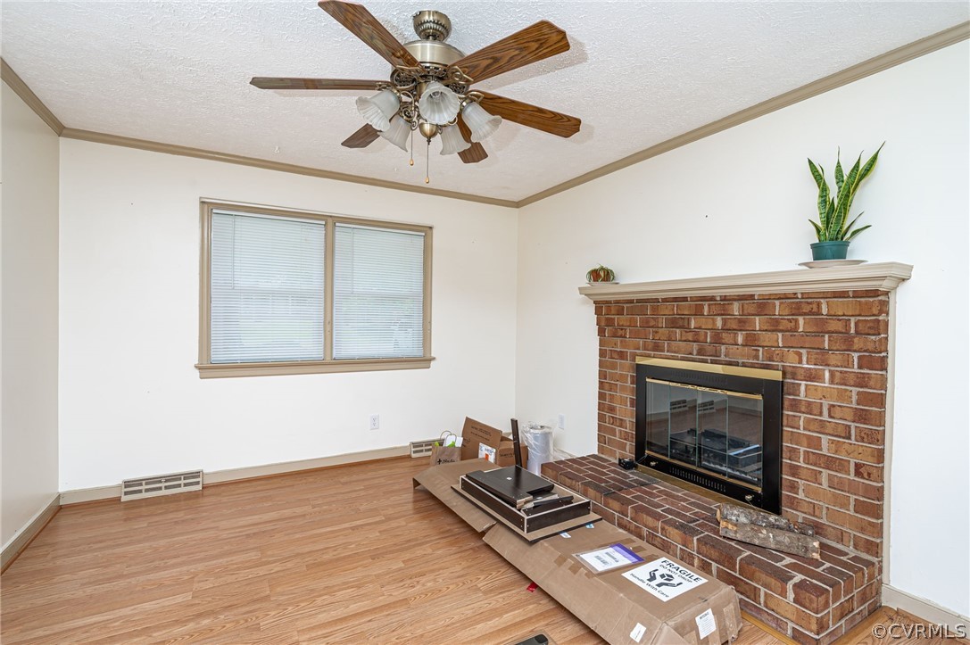 11420 Elshur Road Midlothian, VA 23112 - Photo 10 of 25 a living room with furniture and a fireplace