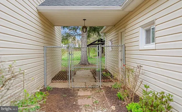 a view of a chair and table in backyard