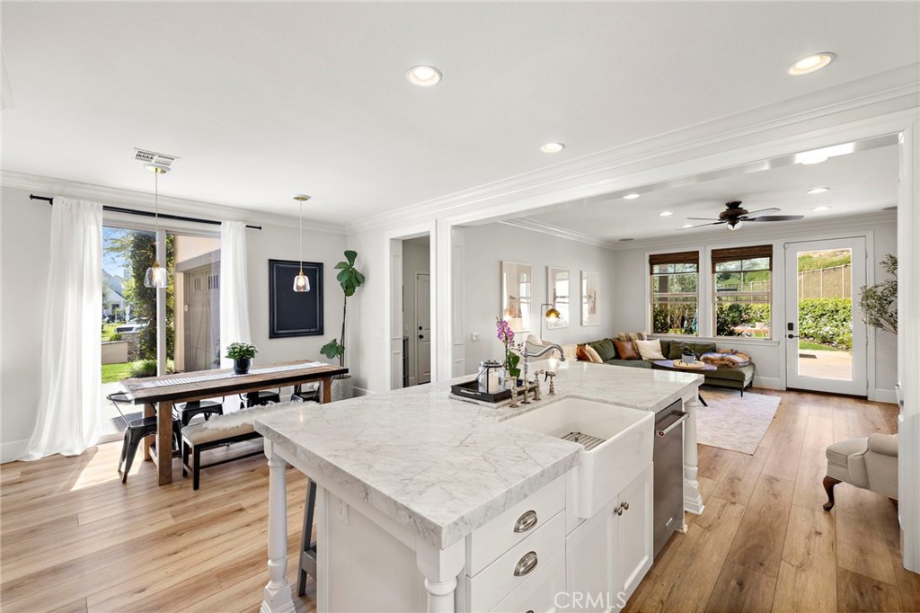 21 Snow Bush Street Ladera Ranch, CA 92694 - Photo 15 of 73 a view of a kitchen counter top space with furniture wooden floor and windows