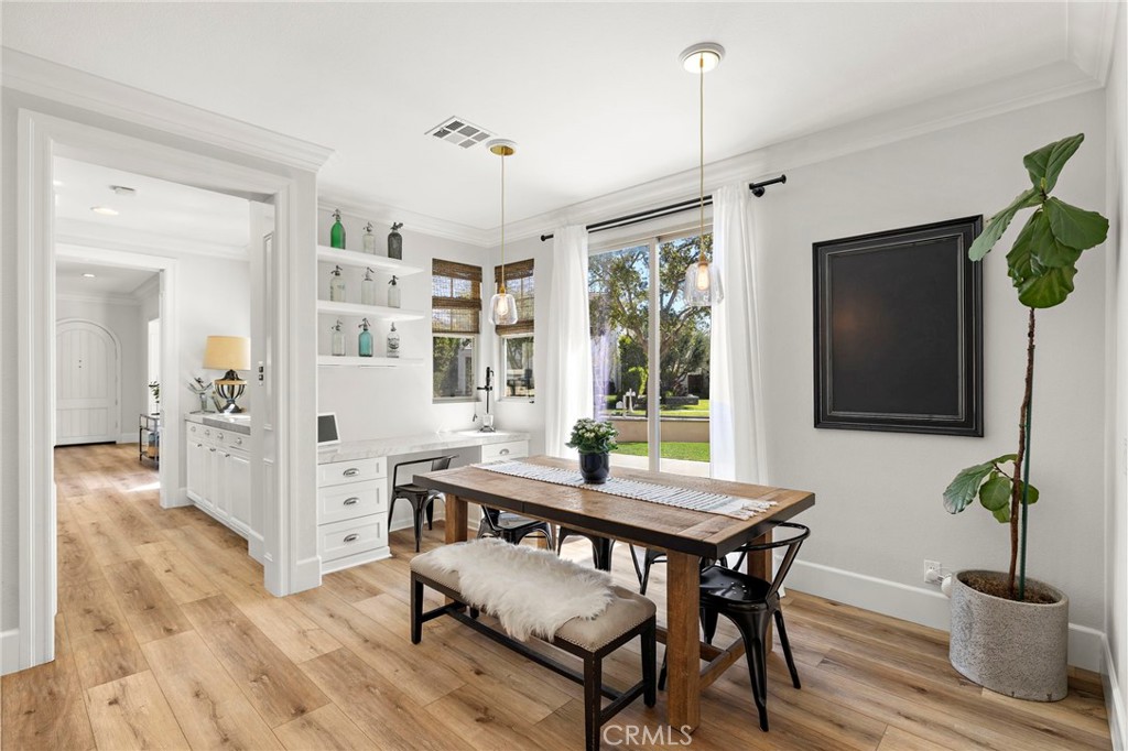 21 Snow Bush Street Ladera Ranch, CA 92694 - Photo 16 of 73 a view of a dining room with furniture window and wooden floor