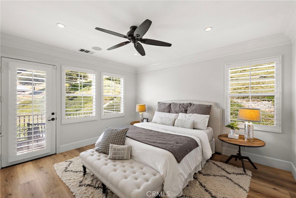 21 Snow Bush Street Ladera Ranch, CA 92694 - Photo 22 of 73 a bedroom with a bed a table and chair