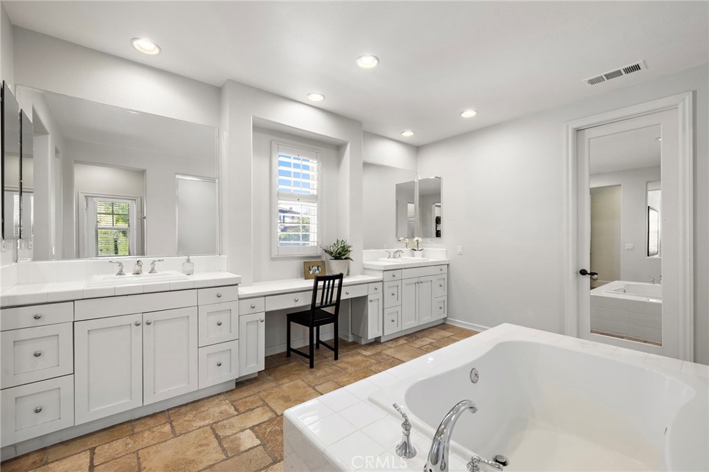 21 Snow Bush Street Ladera Ranch, CA 92694 - Photo 26 of 73 a large bathroom with a tub a sink double vanity and a mirror