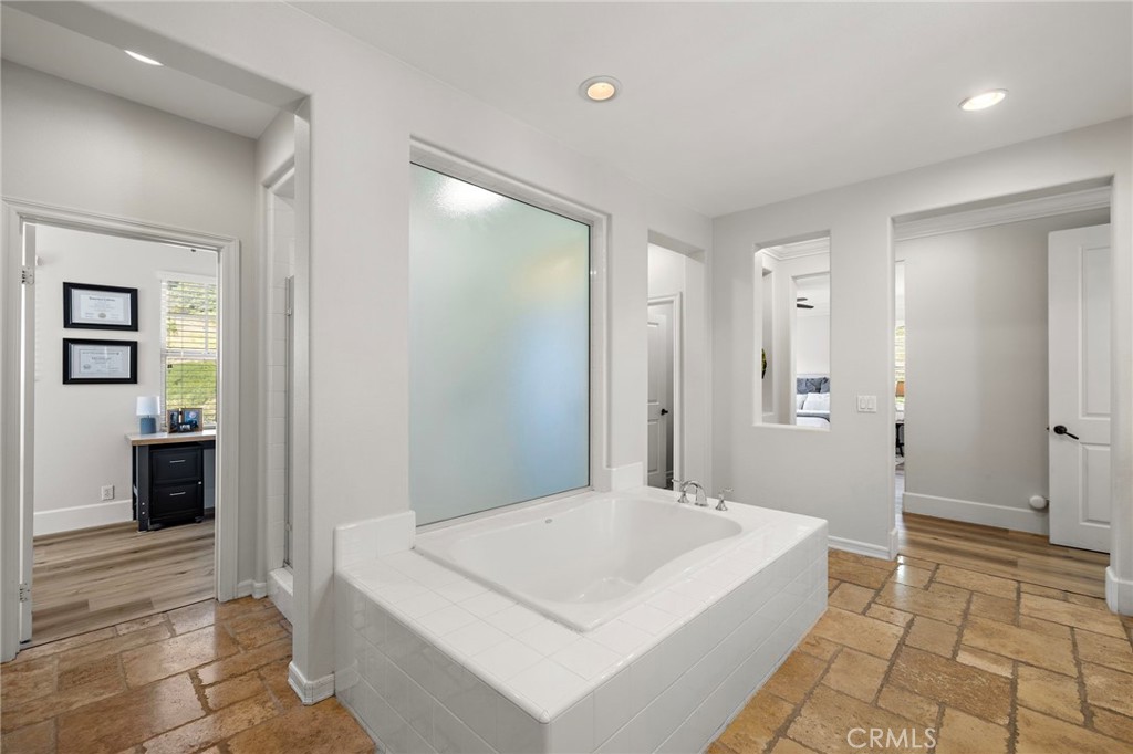 21 Snow Bush Street Ladera Ranch, CA 92694 - Photo 27 of 73 a spacious bathroom with a bathtub sink and toilet