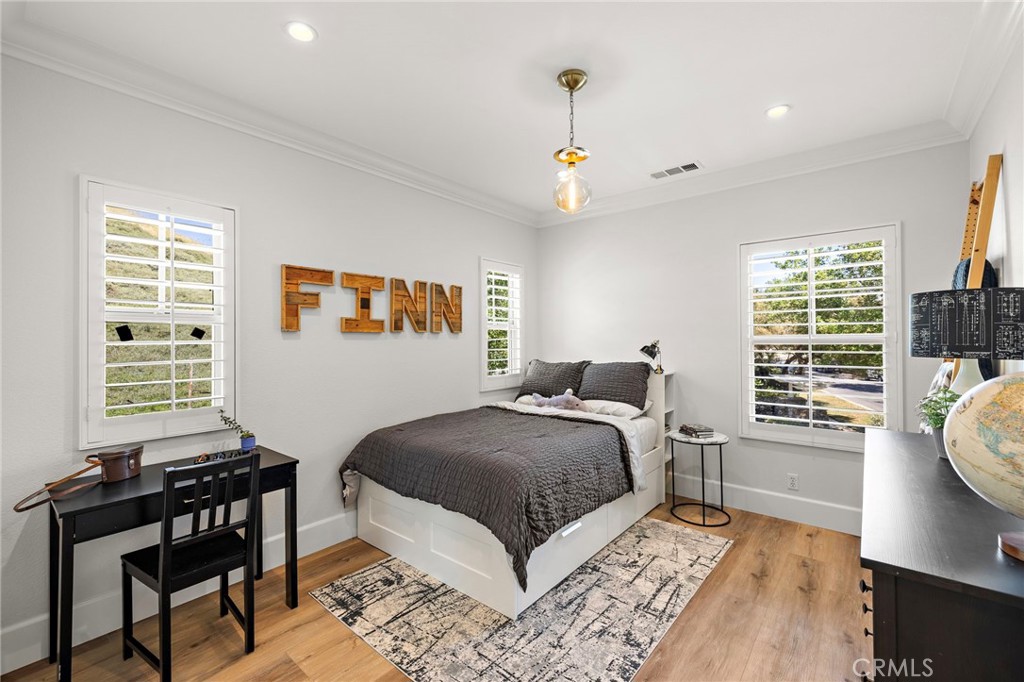 21 Snow Bush Street Ladera Ranch, CA 92694 - Photo 33 of 73 a bedroom with a bed and wooden floor