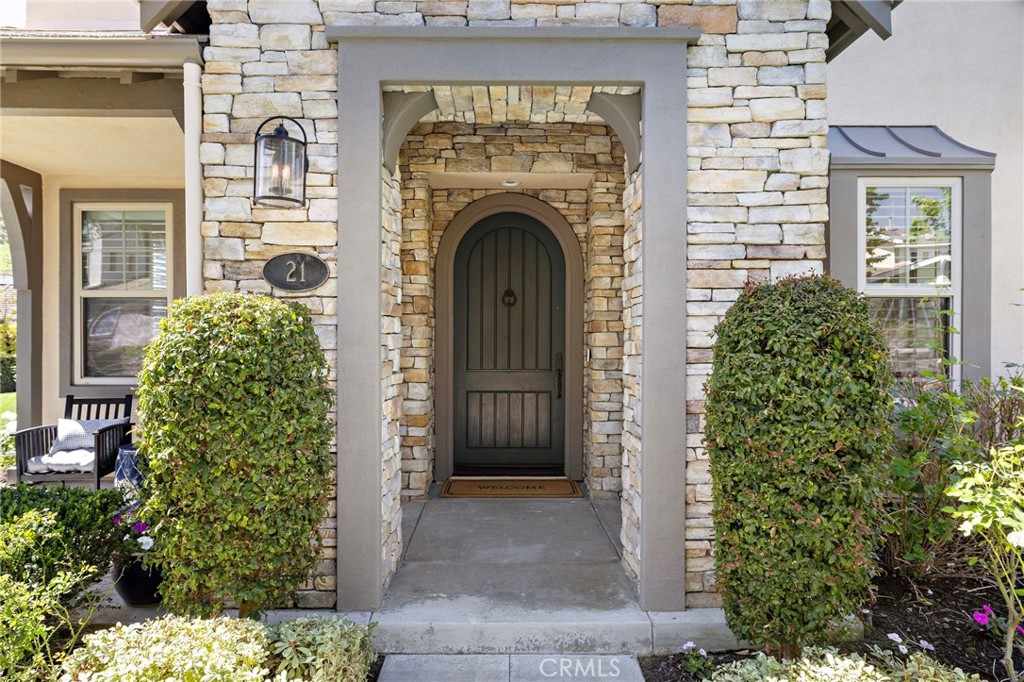 21 Snow Bush Street Ladera Ranch, CA 92694 - Photo 49 of 73 a front view of a house with plants