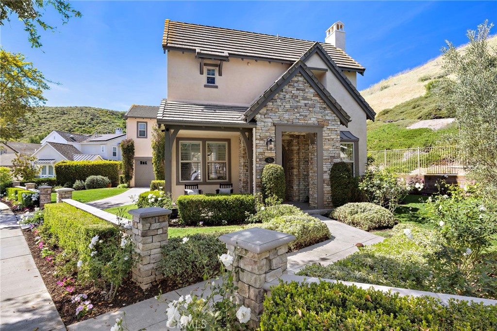 21 Snow Bush Street Ladera Ranch, CA 92694 - Photo 52 of 73 a front view of a house with garden