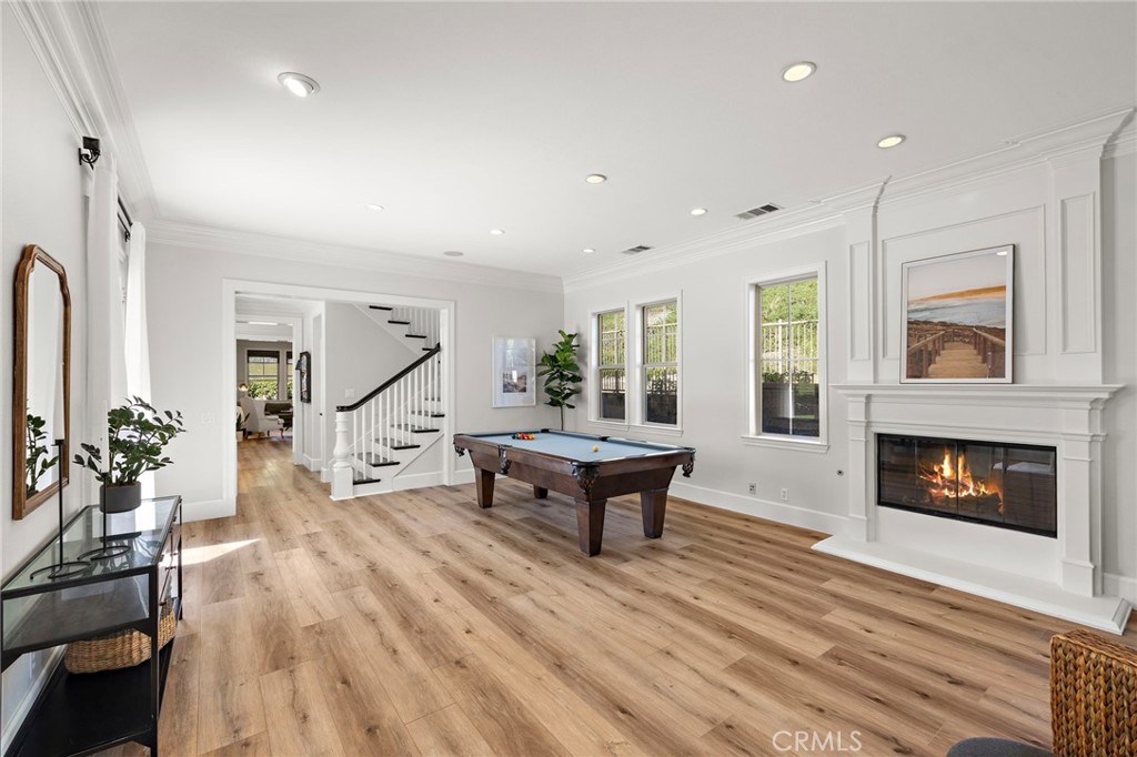 21 Snow Bush Street Ladera Ranch, CA 92694 - Photo 6 of 73 a living room with furniture and a fireplace