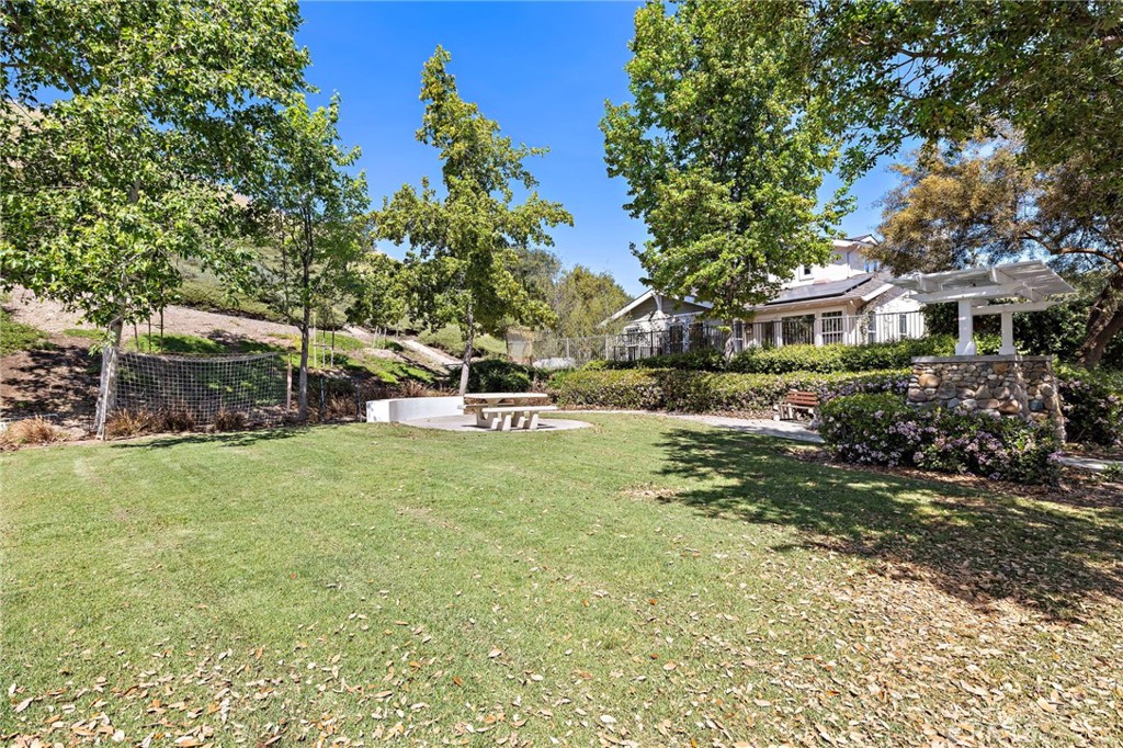 21 Snow Bush Street Ladera Ranch, CA 92694 - Photo 63 of 73 a front view of a house with a garden