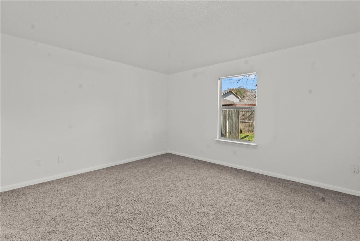 726 Flying Bridge Way Crosby, TX 77532 - Photo 19 of 32 an empty room with windows