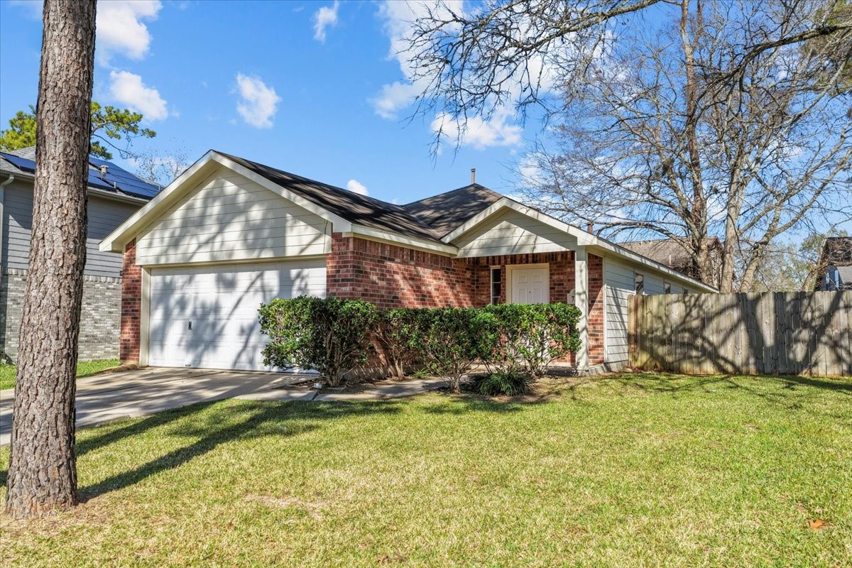726 Flying Bridge Way Crosby, TX 77532 - Photo 2 of 32 a front view of house with yard and trees around